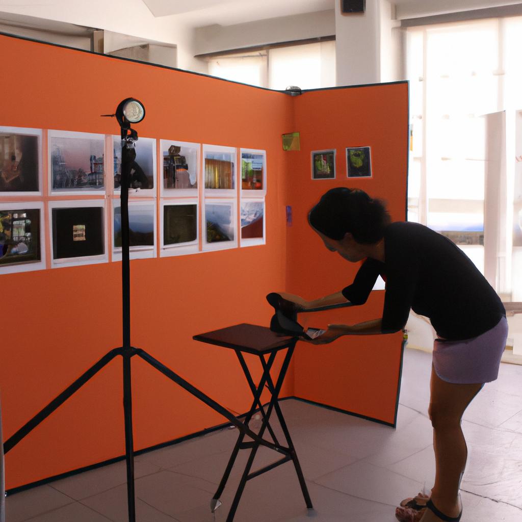 Person setting up art exhibit