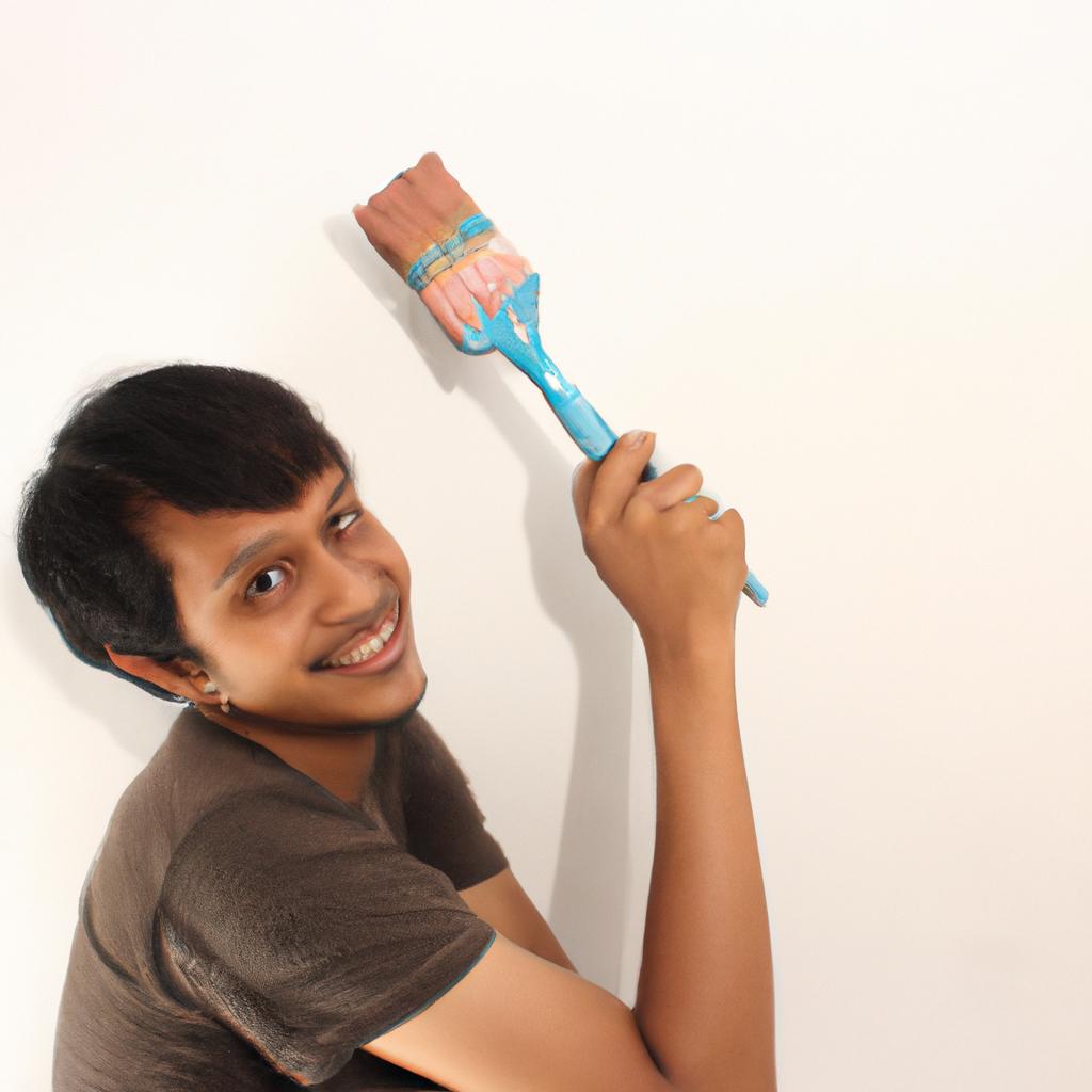Person holding paintbrush, smiling confidently