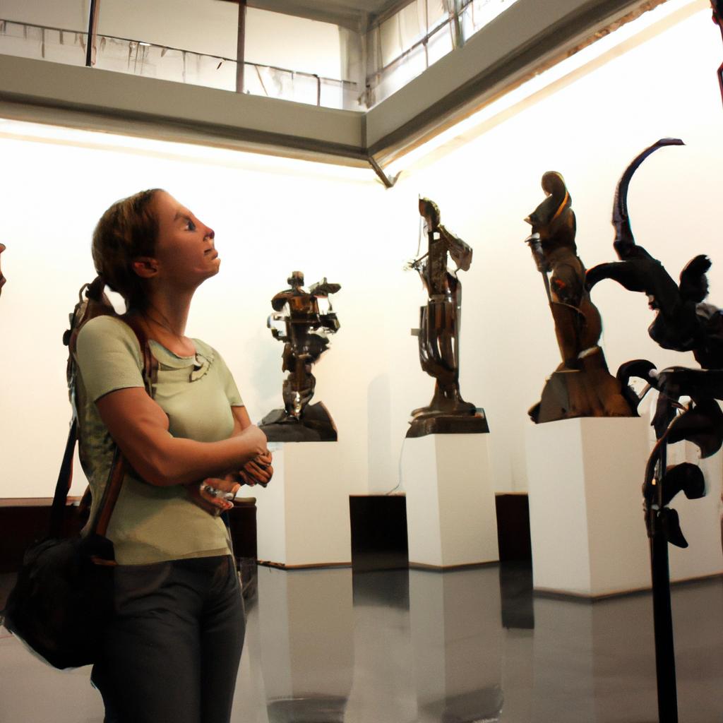 Person admiring sculptures in museum